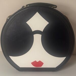 Alice + Olivia collaboration with SteamLine Luggage StaceFace hatbox travel bag.